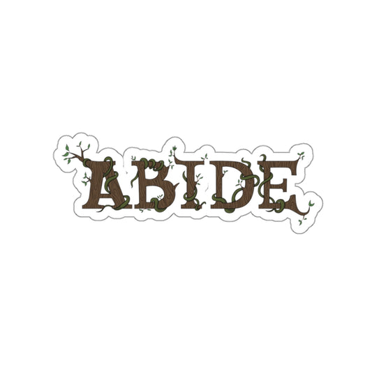 Kiss cut sticker with the word abide as the focus. The letters are brown with green moss weaving in between them. The outline of the sticker is white.