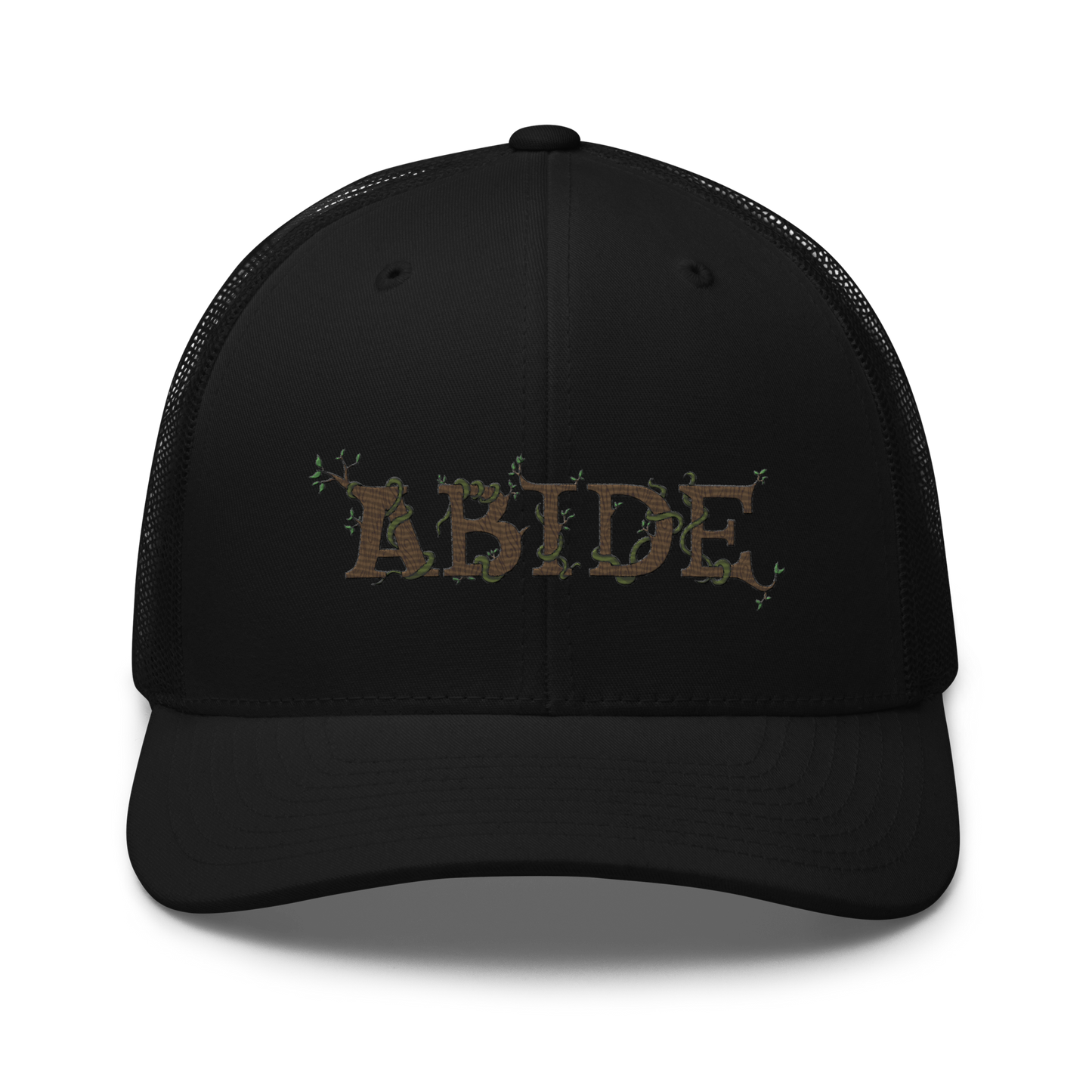 Black trucker hat with the letters Abide on the front. The letters are in brown with green vines wrapped around. The Abide is embroidered on the hat.