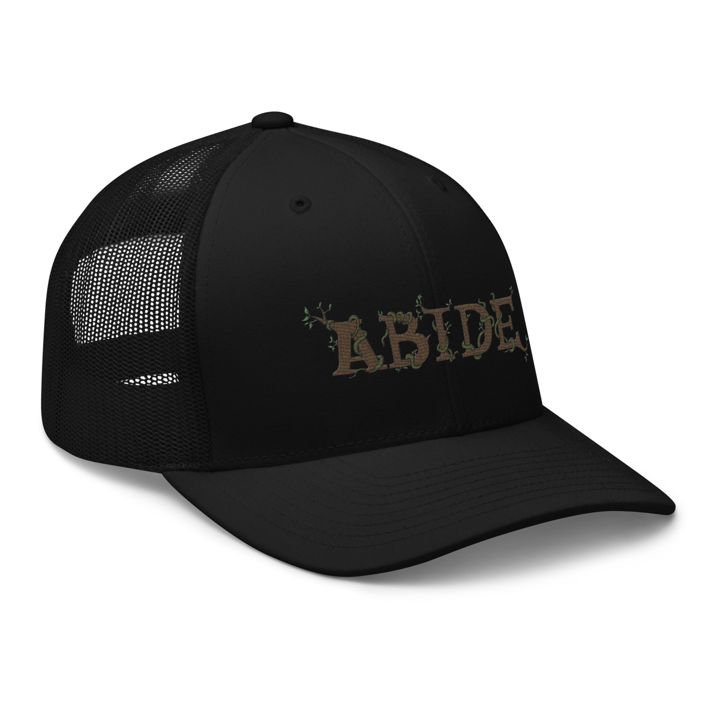 Black trucker hat with the letters Abide on the front. The letters are in brown with green vines wrapped around. The Abide is embroidered on the hat.